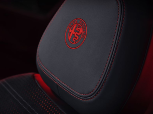 Extreme close up of Alfa Romeo Tonale SUV logo embedded into the interior headrests 