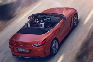 BMW Z4 Convertible exterior colour in red soft top roof down driving